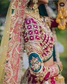 a woman in a red and green bridal outfit