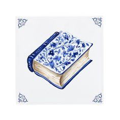 an open book with blue and white designs on the cover is sitting in front of a flowered border