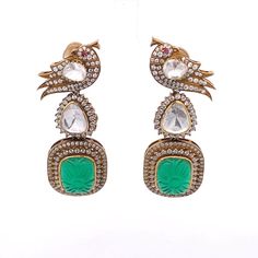 This Traditional Bollywood inspired Indian Earring is studded with fine quality Moissanite and Green stone. It shows the elegance and grace of the earrings. A finely crafted Jewelry in 925 Silver, this is an absolutely real looking Indian style earring with high carat gold plated silver. The beautiful Parrot design on the top accentuates the look and makes it stand out. Gross Weight: 38.07 gms Dimensions: 64 x 23mm You can also go to our shop Home for more: https://www.etsy.com/in-en/shop/TempusGems Packaging and Shipping Your item is packed very carefully to avoid any in-transit damage. We first pack it in a zip pouch and then put it in a Bubble Pouch.  Your order is processed currently in 3-5 business days.  We use Standard Shipping services to ship your order. We are currently offering Silver Gemstone Earrings For Reception, Sterling Silver Hand Set Earrings For Reception, Traditional Green Multi-stone Earrings, Jadau Earrings, Parrot Design, Earring Bridal, Polki Earrings, Indian Earrings, Ancient Jewelry