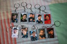 a set of six key chains with pictures of the same person on them, all in different styles and colors