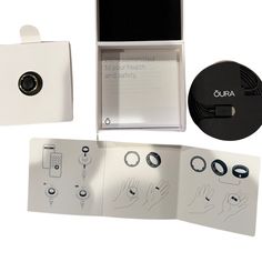 an open box containing several electronic devices and instructions on how to use the device in this case