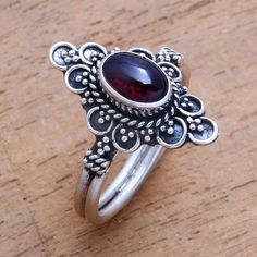 For a dreamy accessory to add to your wardrobe this cocktail ring is designed by Bali's Ketut Sulastri. She handcrafts the ring of sterling silver with an intricate crown that is centered by an oval cabochon of gleaming red garnet. Dream Jewelry, Jewelry Packaging, Red Garnet, Oval Cabochon, Cocktail Ring, Jewelry Gift Box, Free Jewelry, Cocktail Rings, Jewelry Inspiration