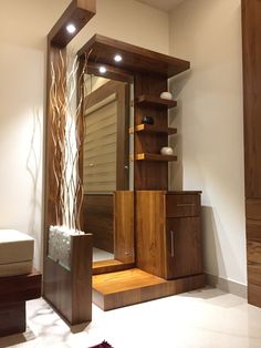 a large mirror sitting on top of a wooden shelf