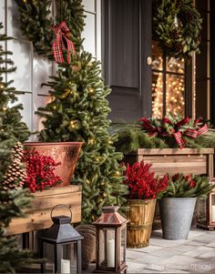 christmas wreaths and potted trees on the front porch