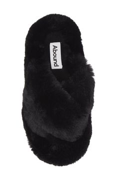 Plush faux fur straps and a footbed envelop your feet in comfort, allowing you to lounge in style. Polyester faux fur upper and lining/rubber sole Imported Black Faux Fur Slippers For Winter, Comfortable Black Slippers With Faux Fur Lining, Black Fluffy Slippers For Winter, Black Plush Lined Winter Slippers, Black Synthetic Slippers With Faux Fur Lining, Black Slippers With Faux Fur Lining, Black Faux Fur Slippers With Round Toe, Black Soft Synthetic Slippers, Soft Black Winter Slippers