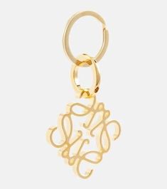 Let your devotion to LOEWE seep into all aspects of life with this Anagram keyring. Made from gold-toned brass, it suspends the label's signature motif - originating from countryside cattle breeding in the label's native Spain - and an engraved moniker. Style with the coordinating accessories, or gift to a fellow label lover..Made in Spain.Material: brass.Length 8,6cm-3.5'.Width 4,9cm-2' Metal Pendant Jewelry With Gold-tone Logo Plaque, Logo Charm Keychains For Gifts, Gift Keychain With Logo Charm, Gold Jewelry With Metal Logo For Gifts, Gold Jewelry With Metal Logo As A Gift, Gold Keychain With Logo Charm As Gift, Gold Metal Keychain For Gift, Gold Metal Keychain Perfect For Gifts, The Daily Edited