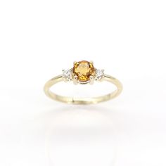 14k Citrine Diamond Ring | 5.0MM Natural Citrine Engagement Ring | 14k Citrine Wedding Ring | November Birthstone | Prong Setting | Handmade Jewelry P R O D U C T 𝄪 D E T A I L S ✽ Metal: 14k Yellow Gold, White Gold & Rose Gold ✽ Bottom Band Width: 1.5 MM ✽ Stone Size: Natural Citrine 5.0 MM x 1pc (approx. 0.5ct) / Natural Diamond 2.3 MM x 2pcs (approx. 0.10ct) ✽ Diamond Color: G ✽ Diamond Clarity: VS2-SI1 ✽ Made to Order ✽ Same Design in Different Birthstone:   - Garnet: https://etsy.me/3NGPA7 Citrine Ring White Gold, Citrine Wedding Ring, Citrine Engagement Ring, Citrine Wedding, Citrine Ring Engagement, Citrine Ring, Natural Citrine, November Birthstone, Blue Zircon