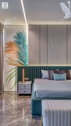 a large bed sitting next to a green plant in a bedroom