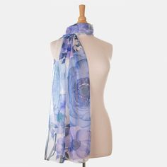 Craving a wardrobe refresh? A single scarf is all it takes to give it new life! This scarf will give your look some ooh la la.Named after the famous piazza in Rome, Campo de' Fiori (field of flowers), this sheer silk Georgette long scarf has a floral print in shades of blue. Details Figure flattering size: Approx. 20” x 67" (53 x 170cm). Years of trial and error taught us that this size scarf is one of the simplest to style and makes every woman look chic. 100% Silk Georgette: A lightweight, she Blue Silk Scarves For Spring, Blue One Size Scarves For Spring, One Size Blue Scarves For Spring, Purple Silk Scarves For Spring, Summer Blue Silk Scarf, Luxury Floral Print Silk Scarf For Women, Luxury Blue Scarf With Floral Print, Luxury Blue Rectangular Silk Scarf, Artistic Blue Silk Scarf