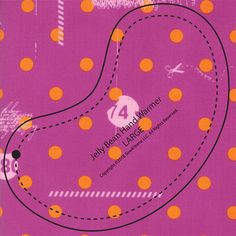 a pink and orange book cover with dots on the front, an arrow in the middle