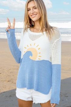 Light, soft, and airy, this knit is perfect for everyone who lives by the beach (or wishes they did!). The fit is relaxed for that easy, breezy look, with a radiant sun graphic hand-embroidered on the center front. Hand-embroidered details were also added as a border in white and blue, with wave graphics chosen to evoke a sense of sea and sky. Composition: 60% cotton, 40% acrylic SIZE CHART See our Measuring Guide for how to measure properly. Measurements are in Centimeters. SIZE CHEST WIDTH (CM Beach White Open Knit Sweater, Lightweight Tops For Beach Season, White Open Knit Beach Sweater, White Summer Sweater For Vacation, Lightweight White Summer Sweater For Vacation, Bohemian Crew Neck Beach Top, Summer Relaxed Fit Crew Neck Sweater, Long Sleeve Summer Tops For Warm Weather, Summer Open Knit Sweater