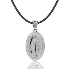 The Virgin Mary Virgencita Necklace is displayed with beautiful attention to detail. The pendant has a beautifully designed texture that makes the image come out and has everything you would want in a Virgin Mary Virgencita Necklace. Make a statement and show your devotion with this virgencita necklace! It is a great gift and a personal keepsake. Experience the power of faith and divine protection under the devotional protection of the Blessed Virgin Mary. The Virgin Mary will always watch over Spiritual Necklace With Miraculous Medal For Commemoration, Commemoration Necklace With Large Round Pendant, Memorial Miraculous Medal Pendant Jewelry, Miraculous Medal Pendant For Memorial, Miraculous Medal Pendant Necklace For Memorials, Miraculous Medal Pendant Necklace For Memorial, Commemorative Pendant Necklaces With Charms, Commemorative Pendant Necklace With Charms, Spiritual Commemoration Necklace With Round Pendant