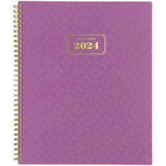 a purple spiral notebook with gold foil on the front and bottom, featuring an image of flowers