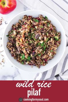 wild rice pilaf in a white bowl with an apple on the side and text overlay that reads wild rice pilaf