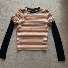 Nwot Size- Small Brand- Forever 21 Made In Vietnam Striped Colors- Orange, Black, White, Cream, And Purple Comment If You Have Questions Striped Tops With Graphic Print For Fall, Trendy Orange Tops For Streetwear, Forever 21 Fall Streetwear Tops, Casual Striped Tops From Forever 21, Forever 21 Brown Spring Top, Orange Long Sleeve Graphic T-shirt, Forever 21 Fitted Brown Top, Cheap Forever 21 Cotton T-shirt, Forever 21 Black Crew Neck T-shirt