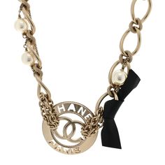 This is an authentic CHANEL Chain CC Necklace in Gold. This chic chain choker style necklace in polished gold. The necklace features multi-linked chains with a textured CC logo and large pearls. 1426751 Luxury Formal Pearl Necklace With Chain, Elegant Metal Necklace With Logo Charm, Elegant Metal Chain Necklace With Logo Charm, Gold-tone Metal Chain Necklace With Logo Charm, Elegant Gold-tone Chain Necklace With Logo Charm, Elegant Gold-tone Necklace With Logo Charm, Luxury Gold-tone Pearl Chain Necklace, Luxury Metal Chain Necklace With Logo Charm, Luxury Metal Pearl Chain Necklace