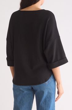 Get cozy in this ribbed tunic top fashioned in a slouchy silhouette with cuffed three-quarter sleeves and a curved high-low hem. 25 1/2" length Crewneck Three-quarter sleeves 88% polyester, 9% viscose, 3% spandex Hand wash, line dry Imported Model stats: 5'10" height, 32" bust, 25" waist, 36" hip. Model is wearing size Small. Modern Tops With Cuffed Sleeves For Fall, Fall 3/4 Sleeve Tops For Loungewear, Oversized Ribbed Top With Batwing Sleeves, Chic Oversized Top With Rolled Sleeves, Oversized Ribbed Batwing Sleeve Top, Modern Long Sleeve Tops With Ribbed Neckline, Fall Tops With Cuffed Sleeves And Relaxed Fit, Spring Batwing Sleeve Tops With Ribbed Cuffs, Fall Ribbed Neckline Batwing Sleeve Tops