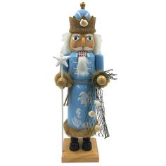 a blue and white nutcracker holding a star