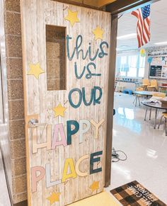 this is our happy place sign in the middle of an empty classroom with chairs and desks