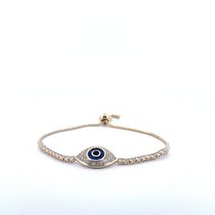 Adorn your wrist with the protective elegance of our 18K Gold Plated Evil Eye Tennis Bracelet. This meticulously crafted piece is more than just an accessory; it's a symbol of protection and good fortune, making it an ideal gift for cherished moments and loved ones. - **Precious Materials Crafted with high-quality 18K gold plating, this bracelet offers the perfect balance of luxury and durability. - **Symbolic Design The evil eye, a symbol believed to ward off negative energies, is at the heart Evil Eye Tennis Bracelet, Evil Eye Design, Bracelet Tennis, Symbol Of Protection, The Evil Eye, Blue Eye, Eye Design, Bat Mitzvah, Tennis Bracelet