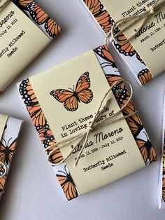 several butterfly themed tags tied together with twine