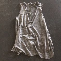 Never Worn Zara Tank. Great Dressing Up For Work And Dressing Down During The Weekends. Has A Silver Shimmer To It, Raw Hems And Awesome Plunge Neckline Chic Silver V-neck Top, Chic Silver Sleeveless Top, Casual Silver Sleeveless Tank Top, Zara V-neck Tops For Layering, Casual Silver Sleeveless Top, Zara V-neck Tank Top For Night Out, Chic Silver Tank Top For Summer, Zara Gray Summer Top, Plunge Neckline