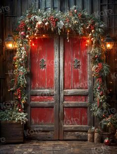 two red doors decorated with christmas garland and lights