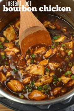 a wooden spoon in a pot filled with chicken