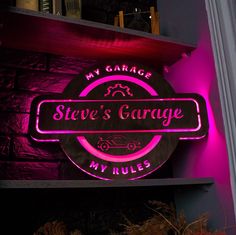 a neon sign that says steve's garage my rules