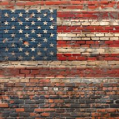 an american flag painted on a brick wall