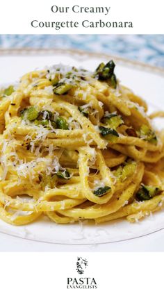 pasta with broccoli and parmesan cheese on a plate