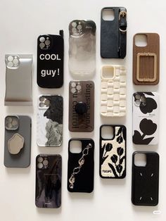 there are many cell phones laid out on the table, all different styles and colors