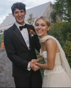 a man in a tuxedo standing next to a woman in a wedding dress