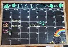 a chalk board with a calendar on it that says march and has a pot of gold at the end