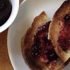 two pieces of toast with jam on them