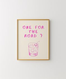 a framed poster that says, one for the road? with a pink drink in it