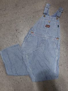 "Kid's vintage 1960s blue and white hickory stripe denim overalls by Ely & Walker 'Red Ball' Sanforized Denim. Made in U.S.A Features single button fly No Tag Approximately sz. 7 (U.S.A Kid's) Measurement taken laying flat: Waist: 13\" Front Rise: 9.5\" Length (from top of bib to hem of leg):40\" Inseam: 22\" Pant legs have been patched from the inside in several spots, as pictured. In otherwise good vintage condition. International Shipping available" Long Overalls, Kids Overalls, Jeans Overall, Red Ball, Ely, Denim Overalls, Vintage Children, Overalls, Kids Outfits