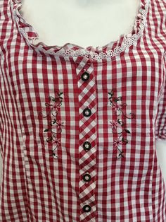 Excelent condition Vintage gingham cotton shirt. Size 42 EU/44 FR/44 ES/IT/PT/ 14 GB Button closure un front. Sewn on flowers on front. Short sleeves with rubber closure. Cotton lace trim. Waist circumference 89 cm/ 44 1/2 inches Breast circumference 96 cm/48 inches Hips circumference 102 cm/ 51 inches Length of a blouse 59 cm/29 1/2 inches Colors my be different,depending on your screen settings. Thank you for stepping by, Jolanta. Gingham Shirt With Buttons For Summer, Gingham Buttoned Tops For Spring, Summer Plaid Blouse With Buttons, Summer Gingham Shirt With Buttons, Spring Gingham Cotton Shirt, Spring Cotton Gingham Shirt, Gingham Cotton Blouse With Buttons, Retro Cotton Top With Lace Collar, Plaid Cotton Blouse With Buttons