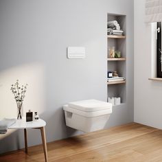 a white toilet sitting in a bathroom next to a wooden table and shelf filled with items