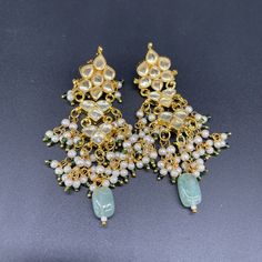 We bring beautiful Jewelry sure to elevate any look! Kindly pay attention to all photos and video and ask questions about the item prior to ordering. Elegant Kundan Danglers For Navratri, Kundan Jhumkas For Festive Occasions, Kundan Bridal Earrings With Tilla For Navratri, Traditional Chandelier Earrings With Latkans For Festive Occasions, Traditional Festive Chandelier Earrings With Latkans, Bollywood Style Danglers For Eid, Kundan Necklace With Latkans For Eid Party, Bollywood Style Festive Chandelier Earrings With Latkans, Bollywood Style Party Chandelier Earrings With Cutdana