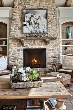 a living room filled with furniture and a fire place in front of a stone fireplace