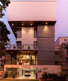 a car is parked in front of a modern house