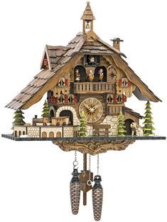 a cuckoo clock with christmas decorations on the front and side of it's face