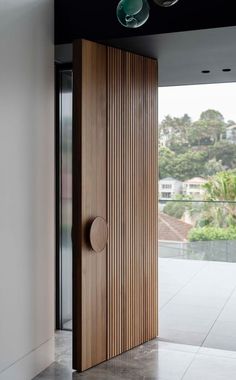 an open wooden door in the middle of a room