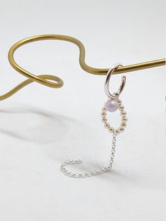 CRYSTAL PEARLED ear cuff - Sold as a single piece - Earcuff no Piercing - Sterling silver - Single Swarovski Crystal Round Pearl, iridiscent pink - 14 3mm Swarovski Crystal Round Pearl, cream - Handmade piece You can put your ear cuff on the top part of your ear, this is the thinnest part of your ear, then slide it down. Sterling Silver Ear Cuff For Wedding, Sterling Silver Single Ear Cuff For Wedding, Wedding Sterling Silver Single Ear Cuff, Silver Crystal Ear Cuff For Party, Wedding Silver Ear Cuff With Pearl Drop, Silver Pearl Drop Ear Cuff For Wedding, Elegant Pearl Ear Cuff Single Earring, Pearl Single Ear Cuff As A Gift, Elegant White Ear Cuff With Pearl Drop