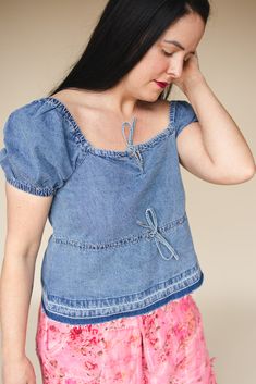 Cinched chambray top with self-ties in cropped length, elastic square neck, cuff & armfole with front placket with tonal step hem. Solid color woven on standard fit. Alluring blend of captivating tonal wash & cropped length for the perfect casual chic harmony. Body length from HPS: 22", Sleeve length: 10", Bust: 39" (Size Small) 100% COTTON Machine wash cold (inside out), Tumble dry low Imported Chambray Top, Cropped Denim Jacket, Trend Forecasting, Cropped Denim, Denim Top, Chambray, Sweater Cardigan, Sweaters & Cardigans, Blue Denim