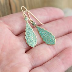 "These casual little earrings are perfect for every day. They are brass/gold with a greenish turquoise patina finish. The pair dangle from 14k gold filled ear wire that comes in two different styles... lever back or ball & hook. (pictured above) The earrings dangle at a total of 45mm (1 3/4\"). If you have any questions please do not hesitate to contact me. ALSO AVAILABLE IN SILVER... https://www.etsy.com/listing/214313768/dangling-silver-earrings-sterling-silver?ref=shop_home_active_15 GOLD Turquoise Earrings With Lever Back Ear Wires For Gifts, Turquoise Earrings With Lever Back Ear Wires As Gift, Dainty Green Teardrop Earrings, Dainty Turquoise Dangle Jewelry, Nickel-free Teardrop Turquoise Jewelry, Dainty Nickel-free Turquoise Earrings, Elegant Turquoise Earrings With Lever Back, Dainty Turquoise Teardrop Jewelry, Turquoise Dainty Jewelry With Earrings Set