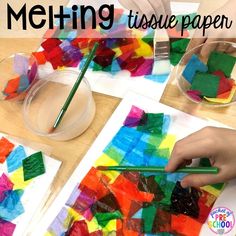 two children are making colorful art with colored paper and watercolors on the table