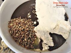 the ingredients for chocolate pudding in a white bowl