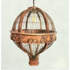 an old fashioned birdcage hanging from the ceiling